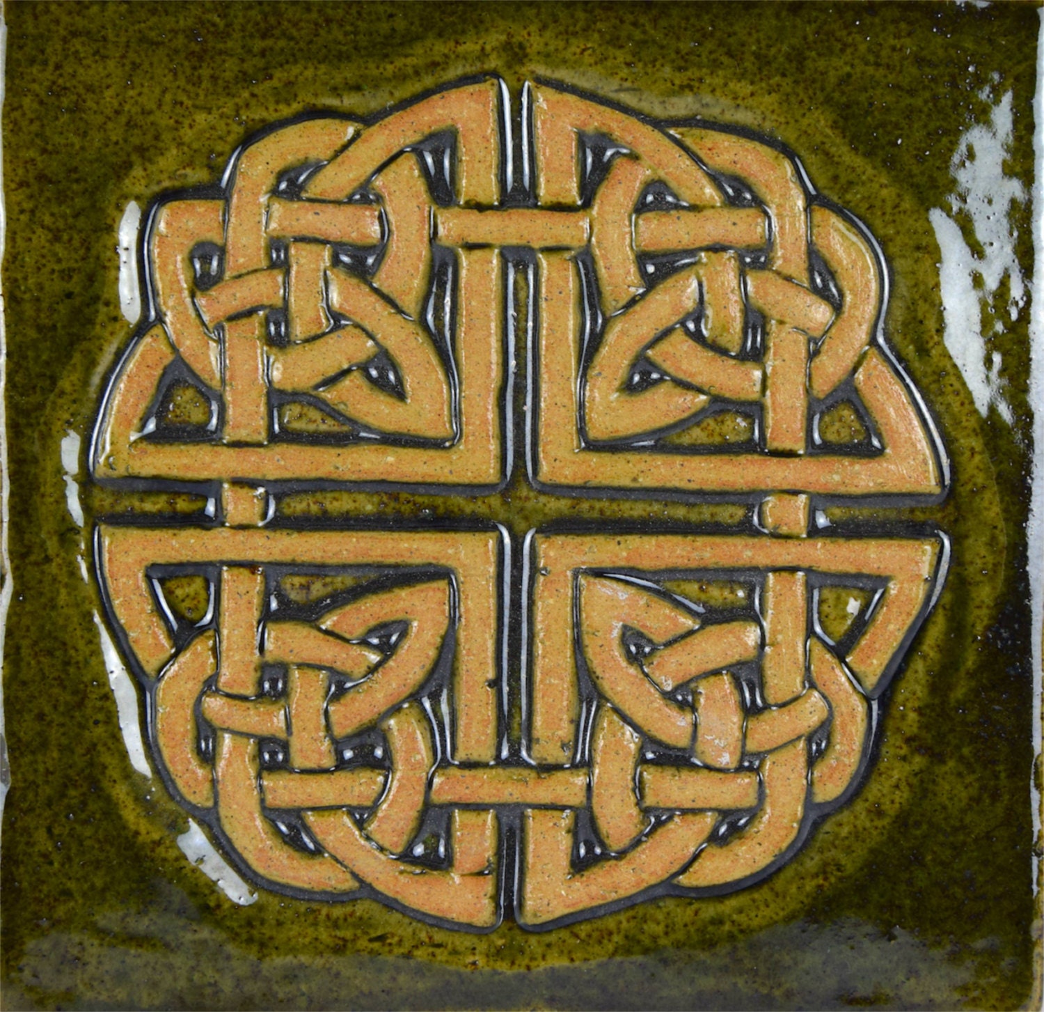 Celtic knot square ceramic tile in moss green glaze