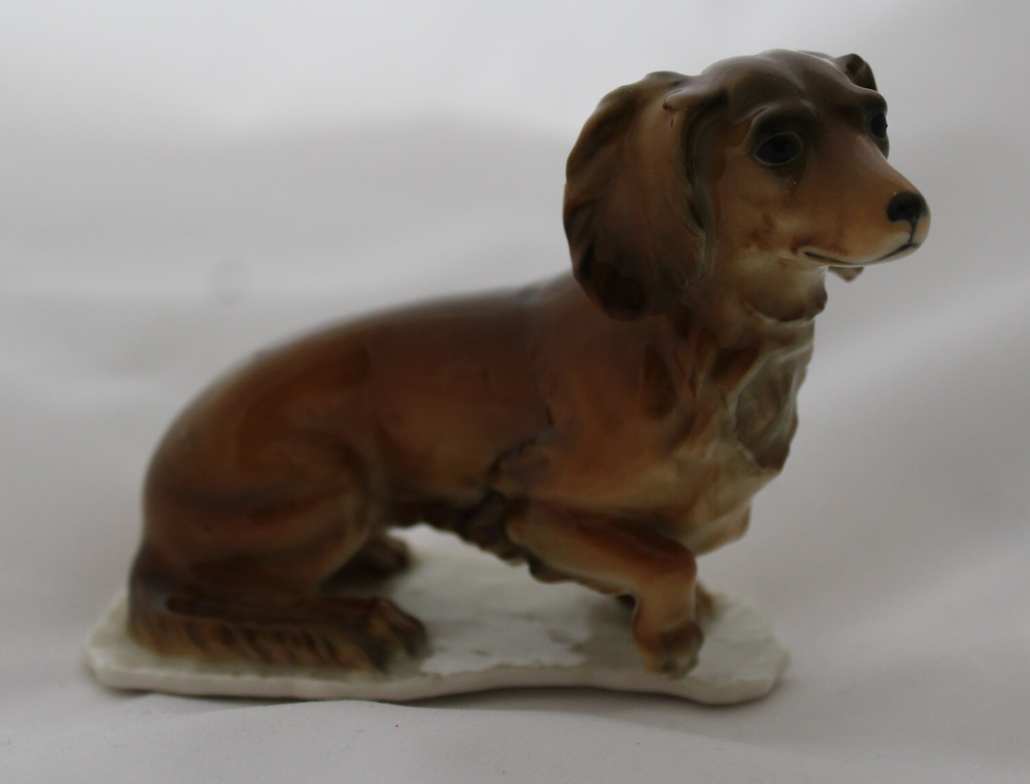 Kaiser Porcelain Longhaired Glazed Dachshund Dog Figurine