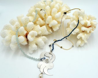 Femme nue couchée necklace. Hand melted and hand engraved with cultivated pearls, jade, goldstone and haematite stars