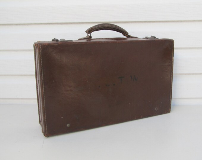 Vintage leather suitcase with travel label Major L.J.T. Weston, old English hand luggage, 1940s home storage decoration, briefcase