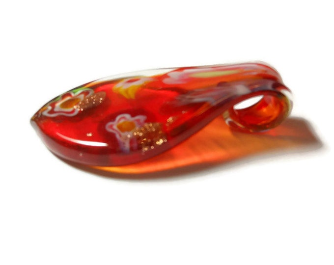 Large lampwork pendant, red yellow and white flowers float on a red background with gold glitter highlights, leaf shape, 60mm X 33mm