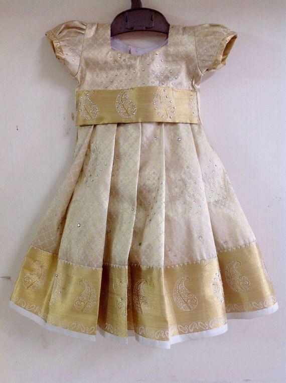 White and gold Silk Pattu pavada with stone work