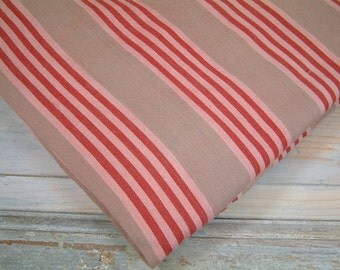 French vintage mattress ticking in beige pink and red stripes. Red stripe mattress ticking fabric. Vintage mattress fabric DIY projects.