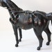 antique leather horse figurine