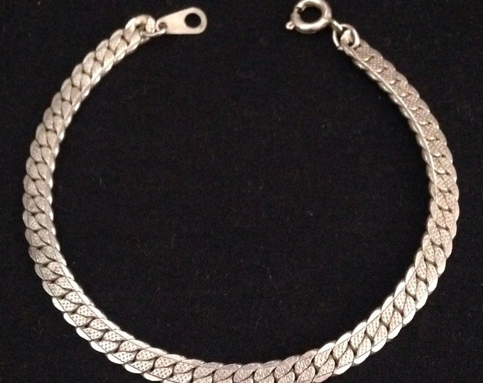 Storewide 25% Off SALE Vintage Silver Tone Elegantly Interlocked Designer Bracelet Featuring Raised Design Style Accent