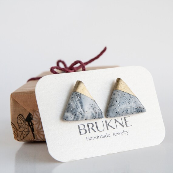 Items similar to Triangle clay stud earrings / Gold dipped stud