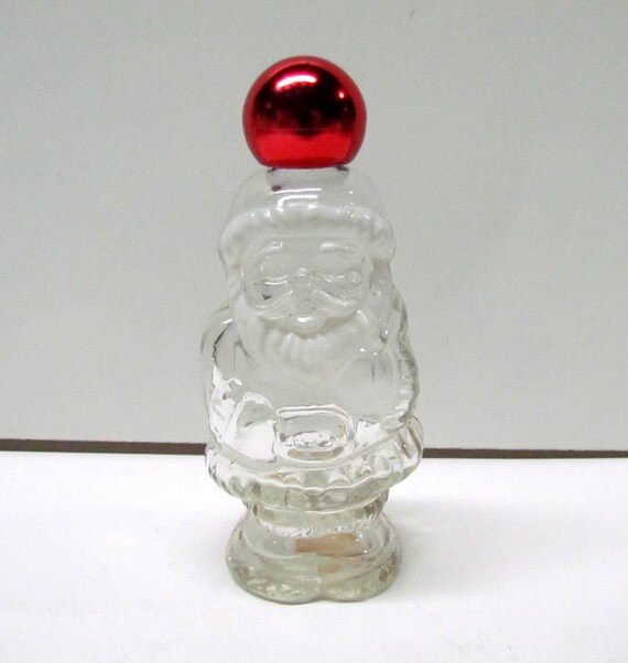 Items similar to Vintage Avon Christmas Jolly Santa Bottle / Figurine ...