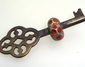 Handmade Lampwork Glass Bead - Beaded skeleton key. Amber gold topaz dots with fine silver leaf on ivory.