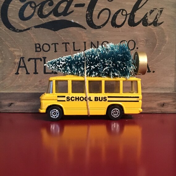 School Bus Carrying Christmas Tree Ornament
