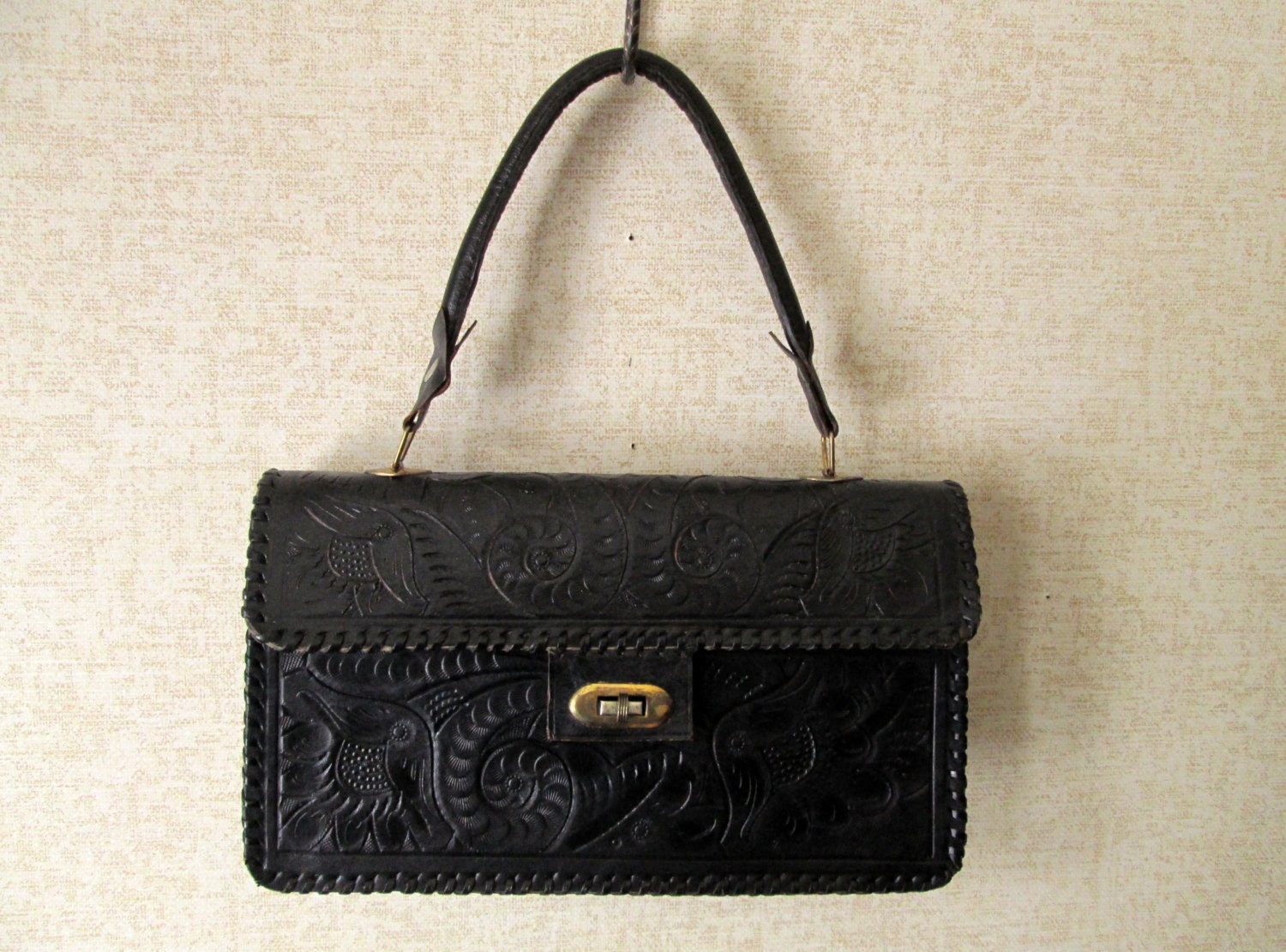 black tooled leather bag