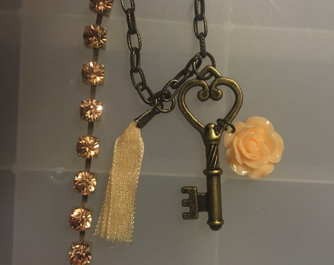 Cream colored skeleton key necklace