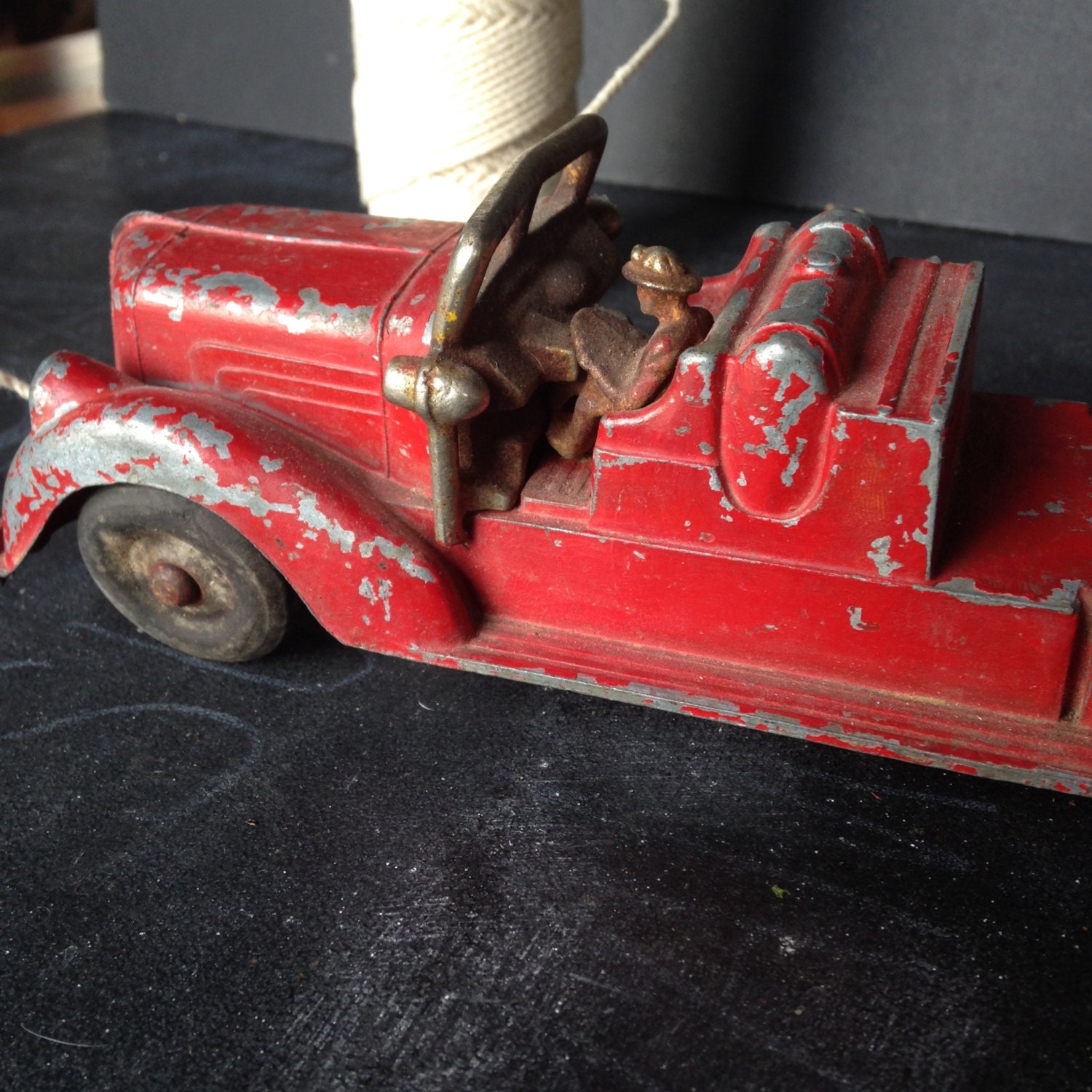 Antique metal toy fire truck with driver vintage 1930s40s