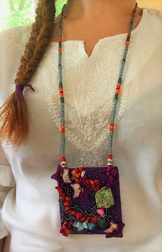 Items similar to Beaded necklace with purple fabric pendant