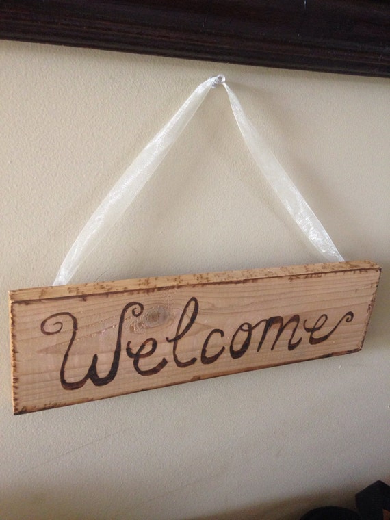 Wood burned welcome sign