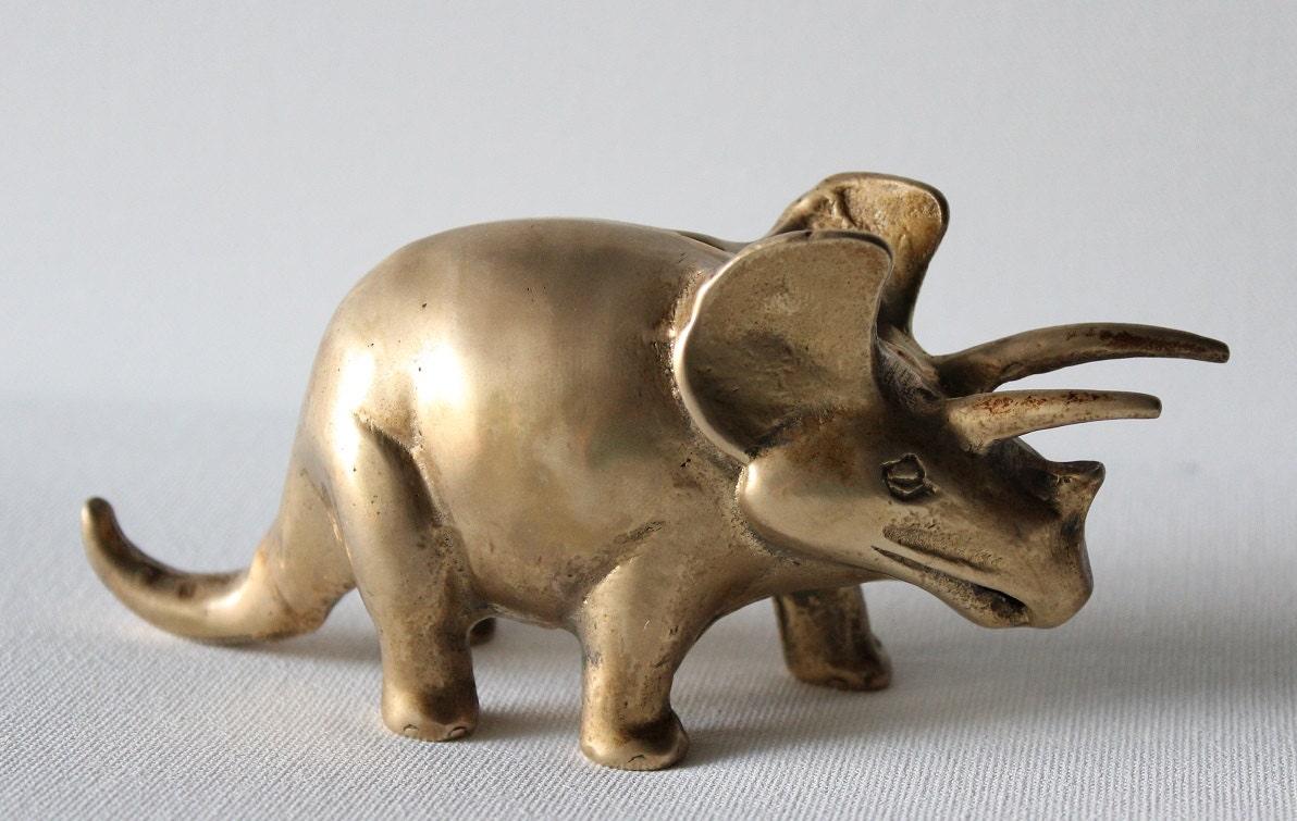 brass dinosaur figurine