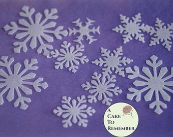 24 Edible snowflakes, wafer paper snowflakes for cake decorating, cupcake decorating, princess cakes, cookie decorating, and winter cakes.
