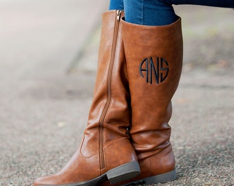 monogram plaque long leather boots