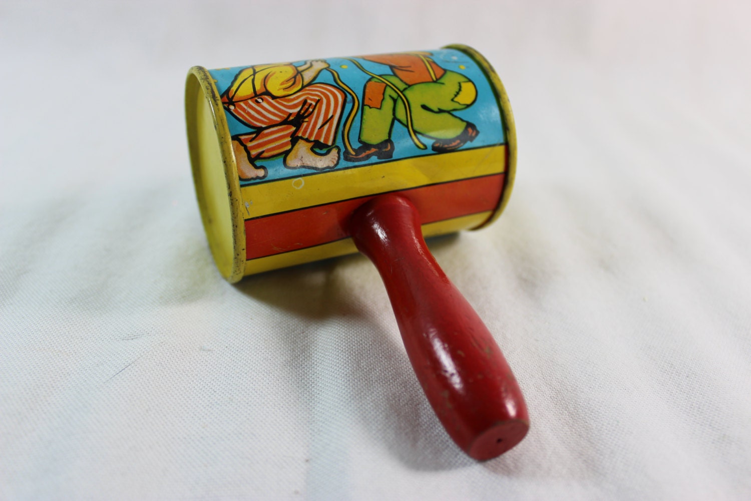 Vintage Metal Tin Toy Noise Maker With Red Wood Handle Clown