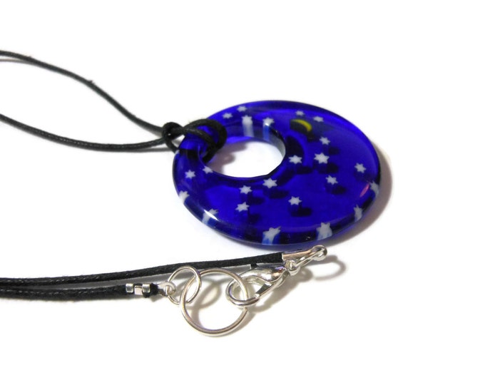 Millefiori glass pendant, 40mm round dark blue with field of stars and a yellow half moon, round go-go on black cord, silver plated findings