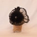 Handmade black ladies side hat decorated with marabou, feathers and jewel detailing