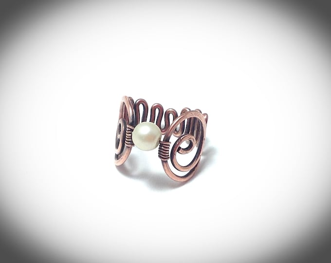 Wire wrapped copper ring with pearl and scroll band