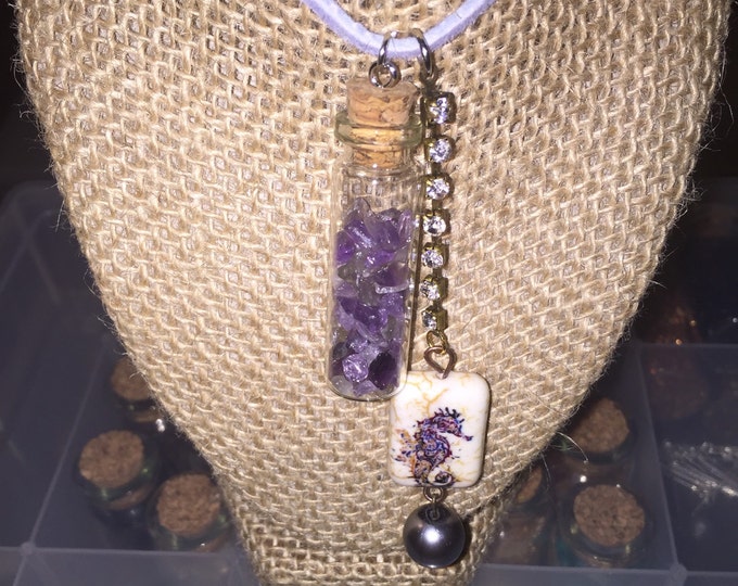 Amethyst gemstones in a mini bottle