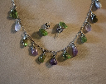 Amethyst and peridot gemstones on a silver necklace with matching peridot errings