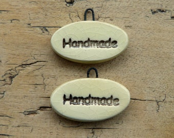 Ceramic charms 'handmade'