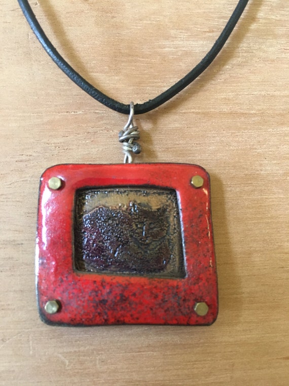 Cat etched in copper with enamel frame dementional; chain length 18 inches (adjustable)
