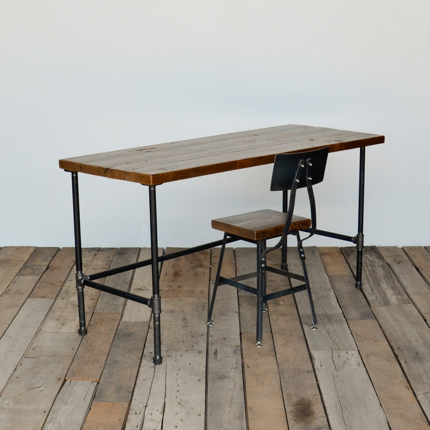 Reclaimed wood desk with modern industrial pipe legs in choice