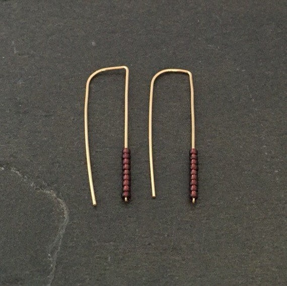 Gold ear tinsel earrings with dark purple beads stick dagger