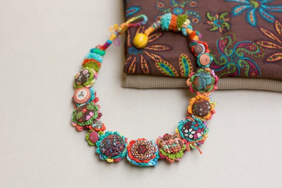 Crochet art necklace fiber jewelry with fabric buttons