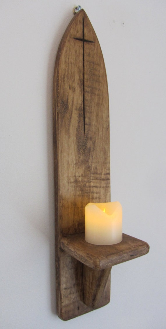 Gothic style wall sconce candle holder with carved cross