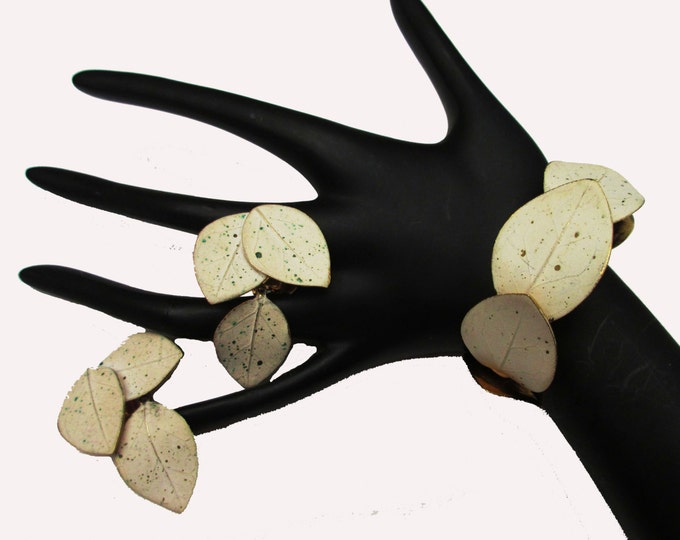 Mosell Bracelet and Earring Set White speckled enamel on gold plated leaves