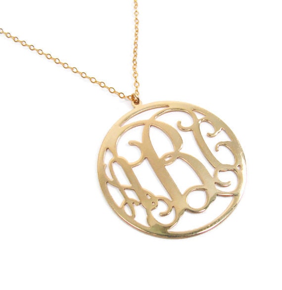 Round monogram Necklace. 1.25.18k gold