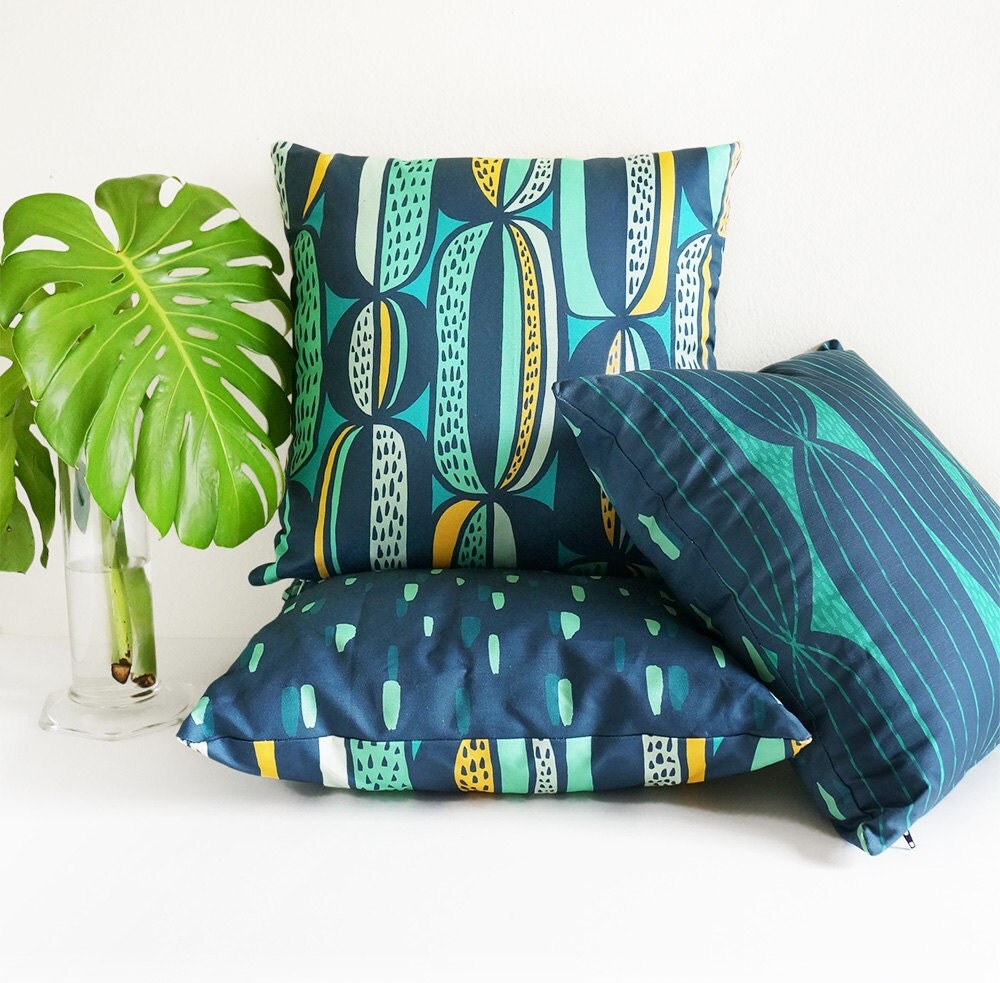 Mid-century modern throw pillow in navy teal & mint