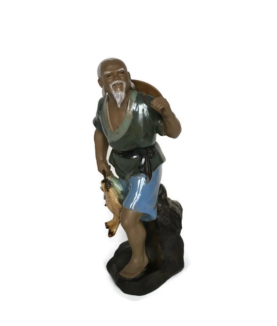 Vintage mudman figurine asian fisherman with fish ceramic statue