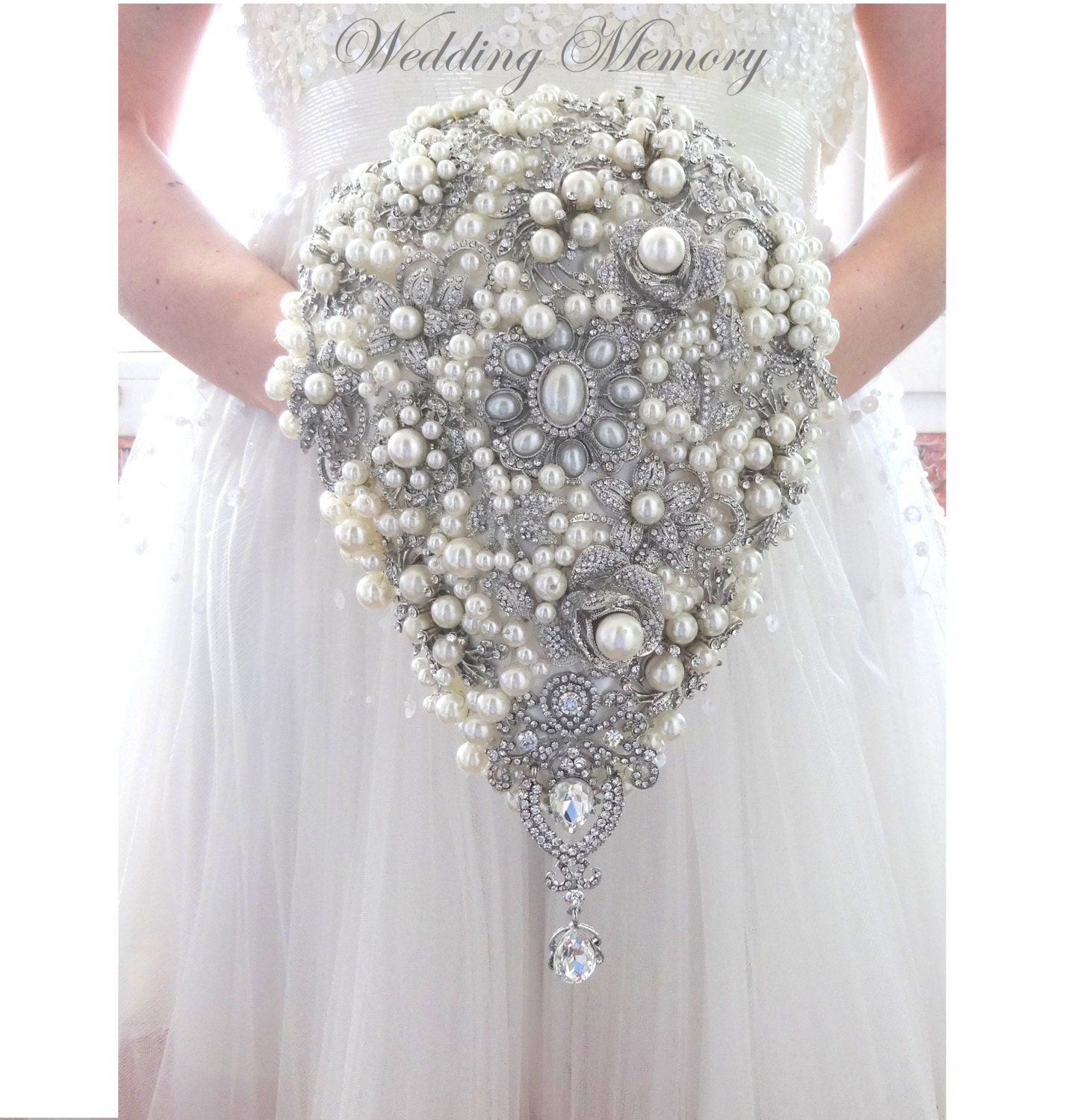 BROOCH BOUQUET. Cascading pearl white ivory brooch bouquet.