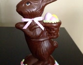 Large Ceramic Chocolate Bunny with colored Easter egss and multicolor flowers