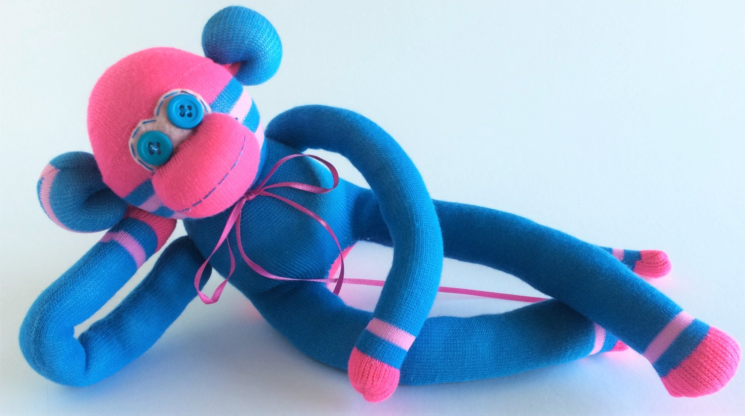 pink striped sock monkey
