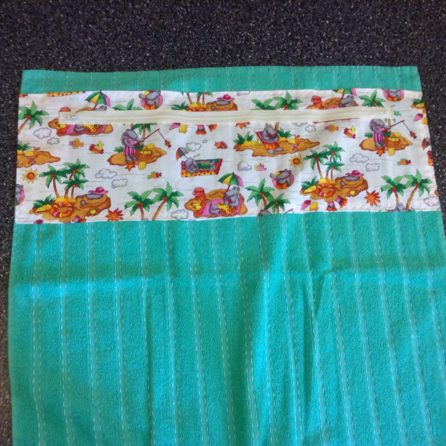 Beach towel with zippered pocket