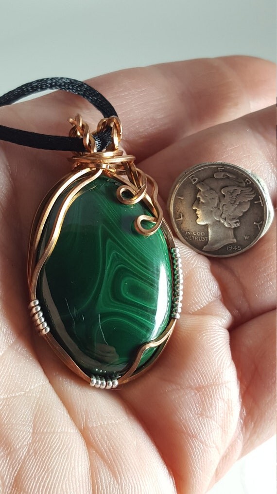 Large oval malachite cabochon wrapped in copper and sterling