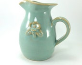 small pitcher with flower