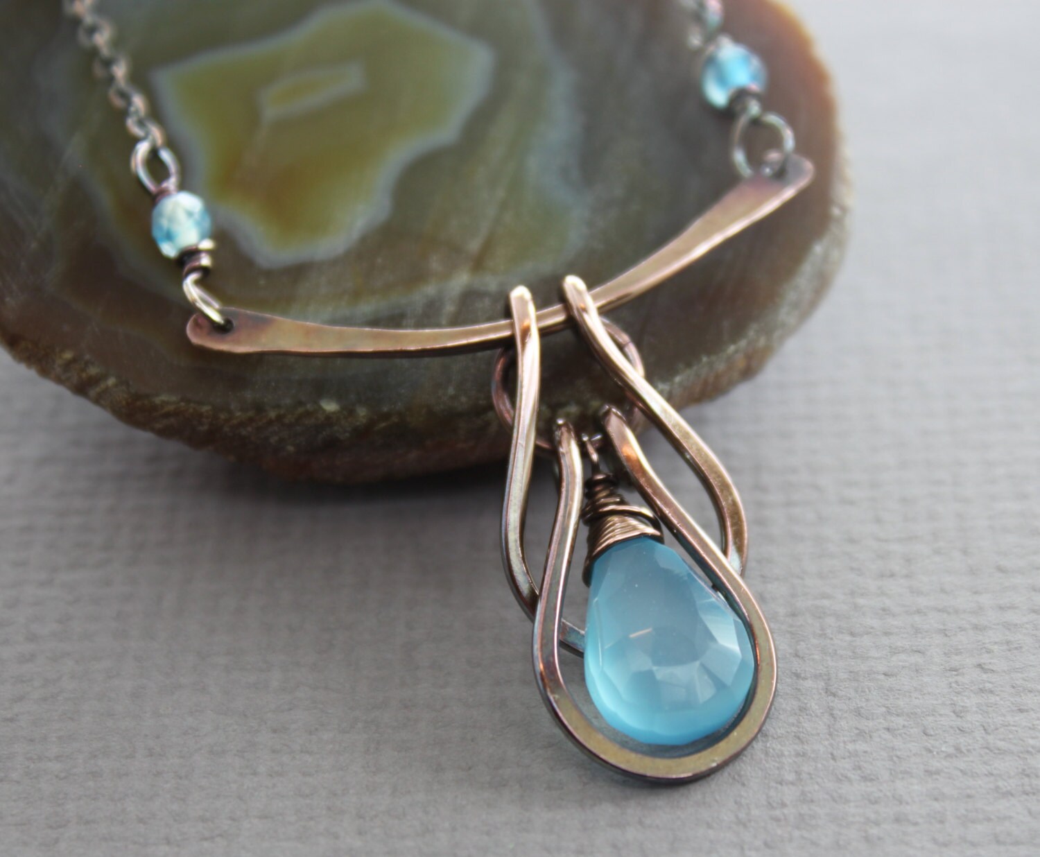 Copper necklace with horseshoe cascade on arch with aqua blue
