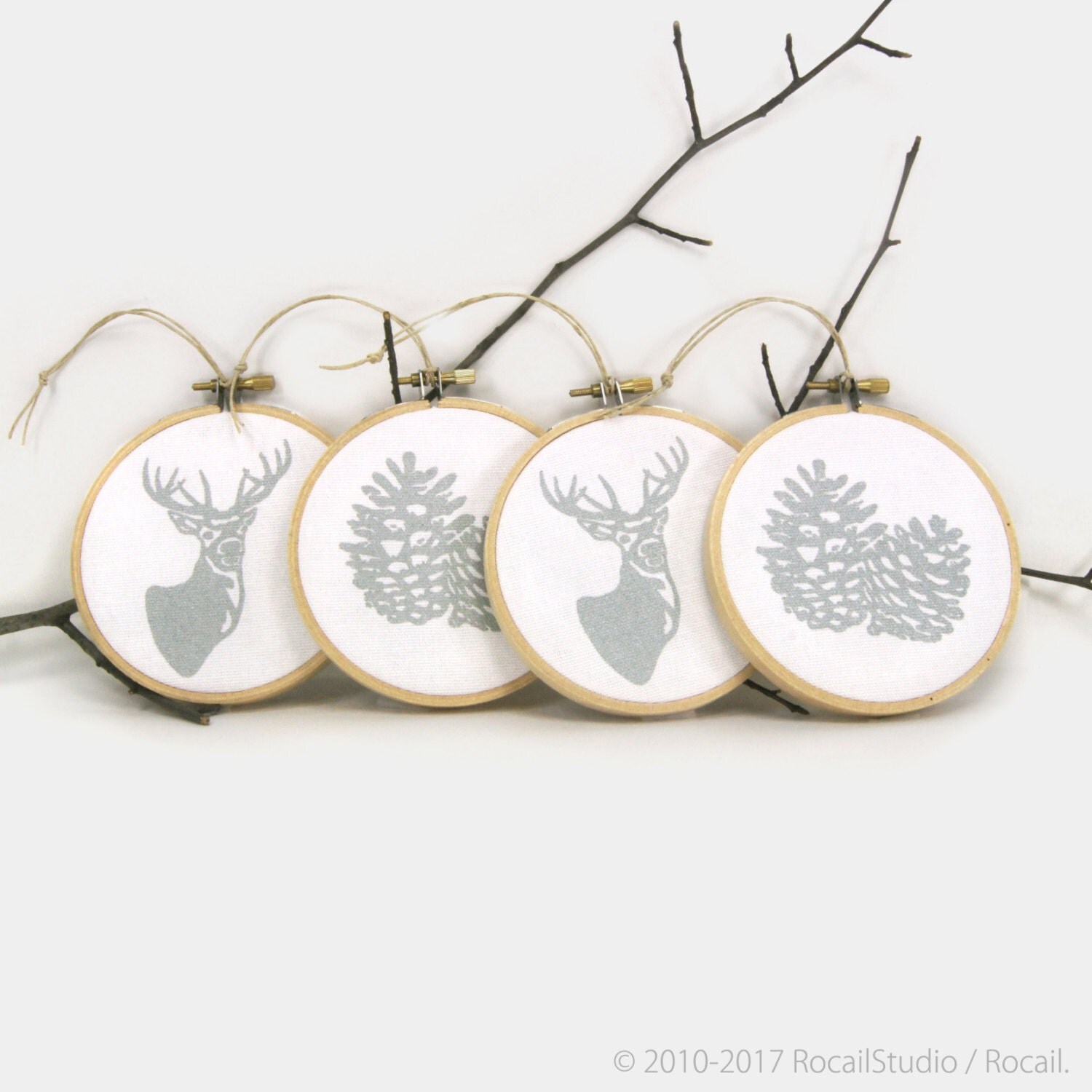 Silver and white Christmas Ornaments with deer and pinecone