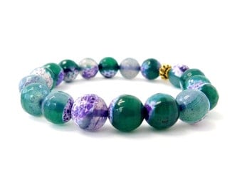 Items similar to purple and green bracelet on Etsy