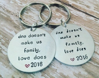 Custom hand stamped adoption keychain, step family jewelry, step parent gift, adoption gift, inlaw gift, dna doesnt make us family love does