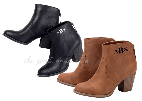 monogram plaque long leather boots