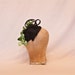 Unique handmade small black hat/fascinator with green orchid decoration