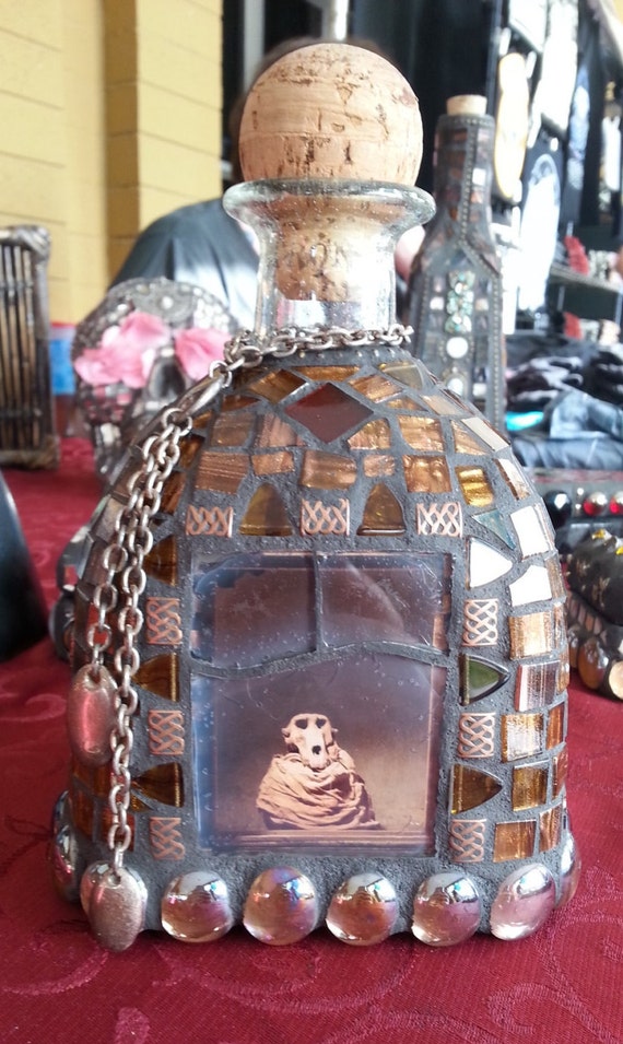 Mosaic skull tequila bottle with gold chain and gold tile